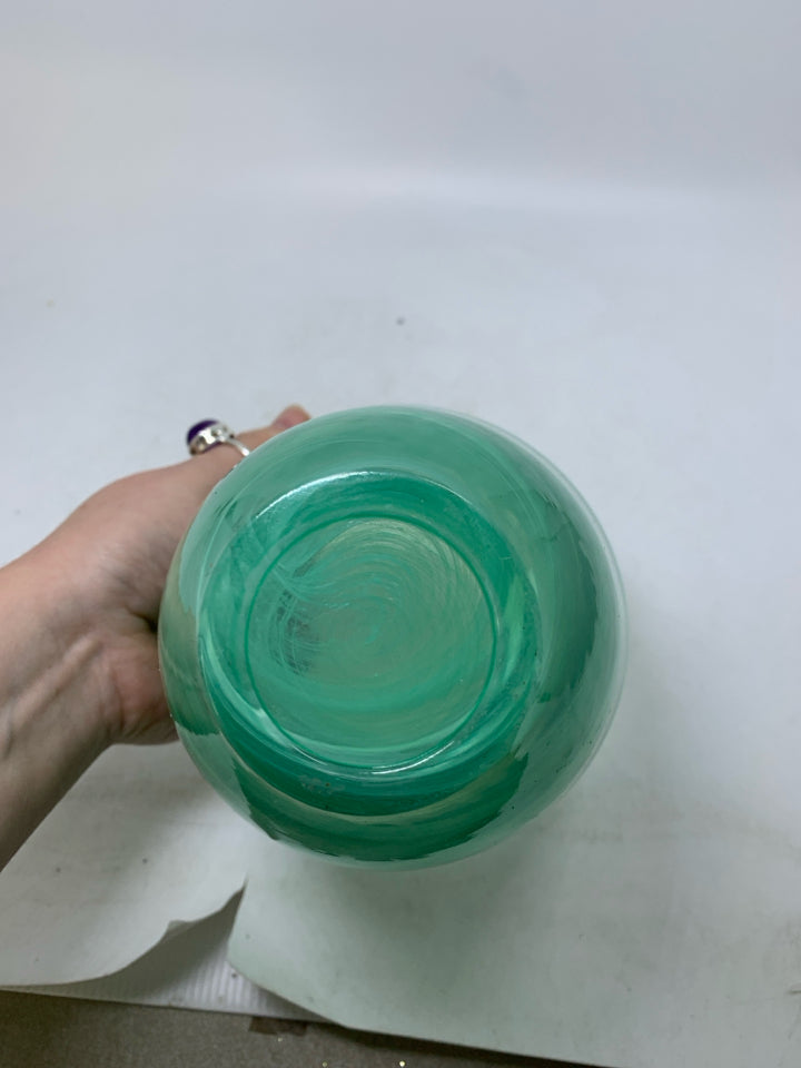 HEAVY GREEN GLASS VASE W/ WHITE SWIRL DETAILS.