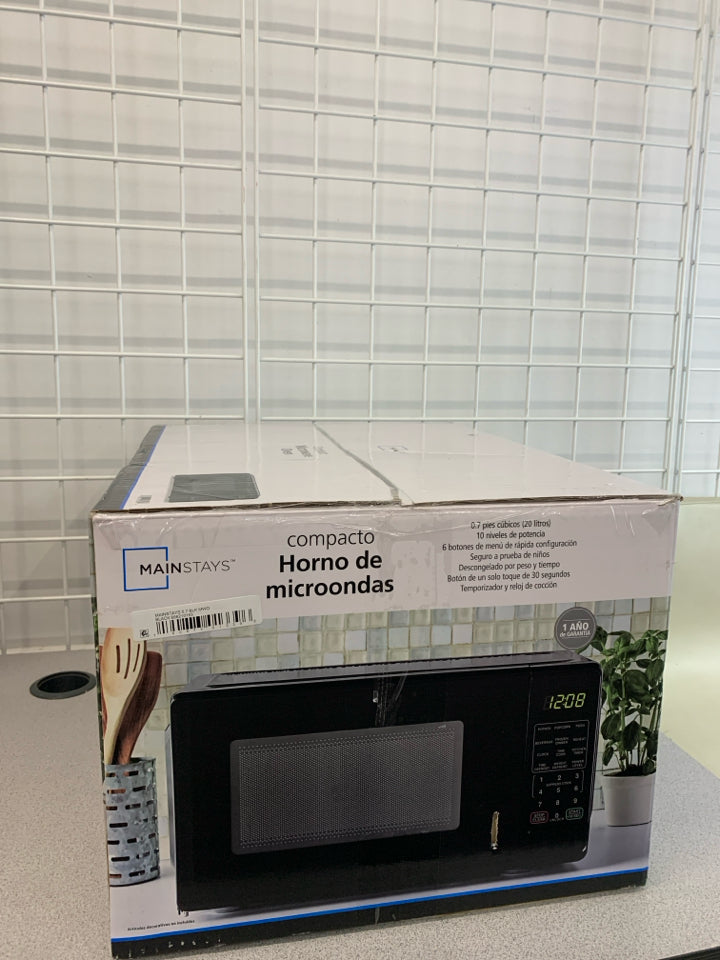 NIB MICROWAVE OVEN.