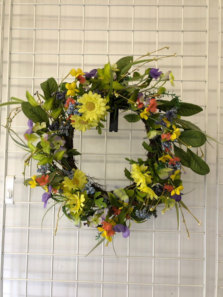 PURPLE AND YELLOW FAUX FLORAL WREATH.