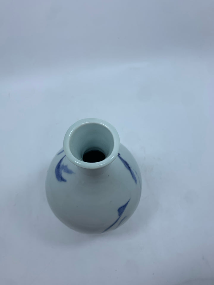WHITE POTTERY VASE W/BLUE DESIGNS.