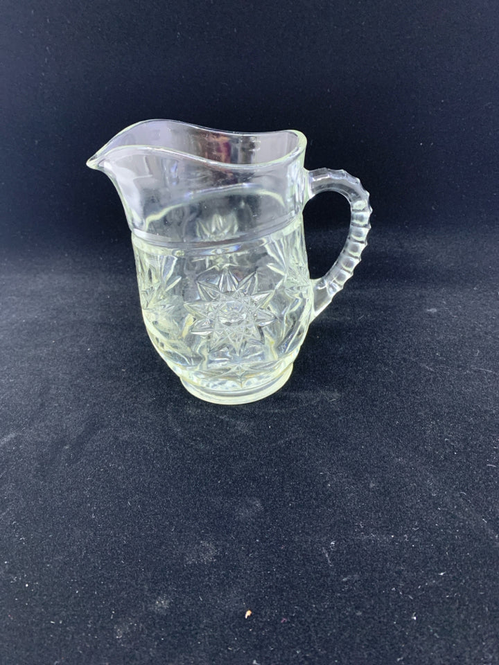SMALL CUT GLASS STAR PATTERN PITCHER.