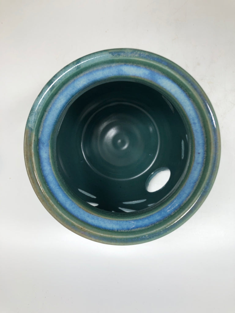 GRASS CUT-OUT BLUE GLAZED CANDLE HOLDER.