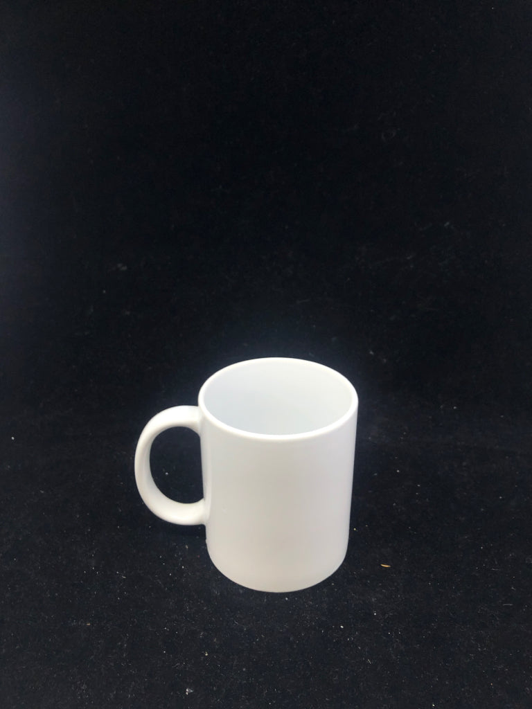 WHITE CERAMIC MUG.