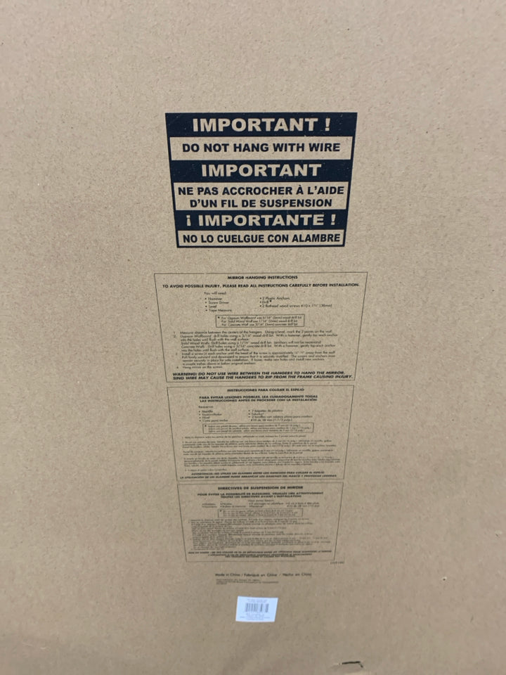 LARGE MIRROR W/BROWN RIBBED FRAME.