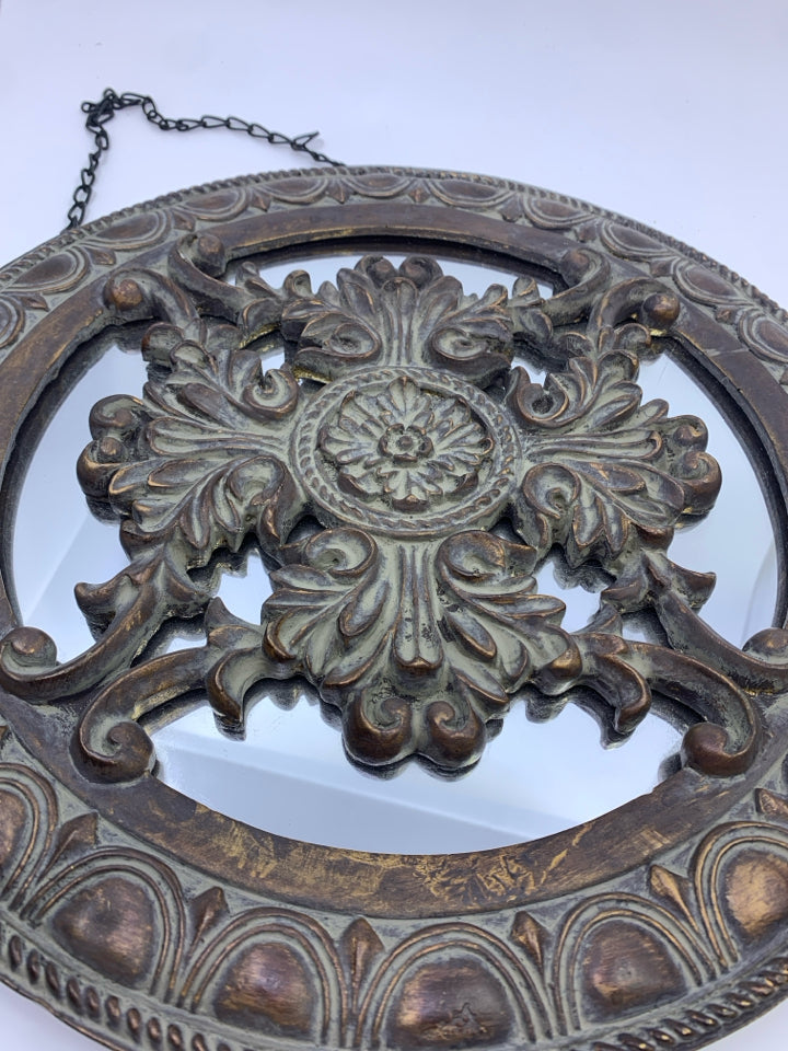 DARK WOOD CIRCLE SCROLL MIRROR IN BACK WALL ART.