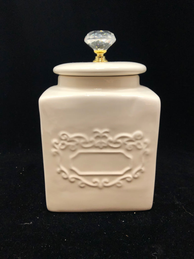 CREAM CERAMIC JAR W/JEWEL LID.
