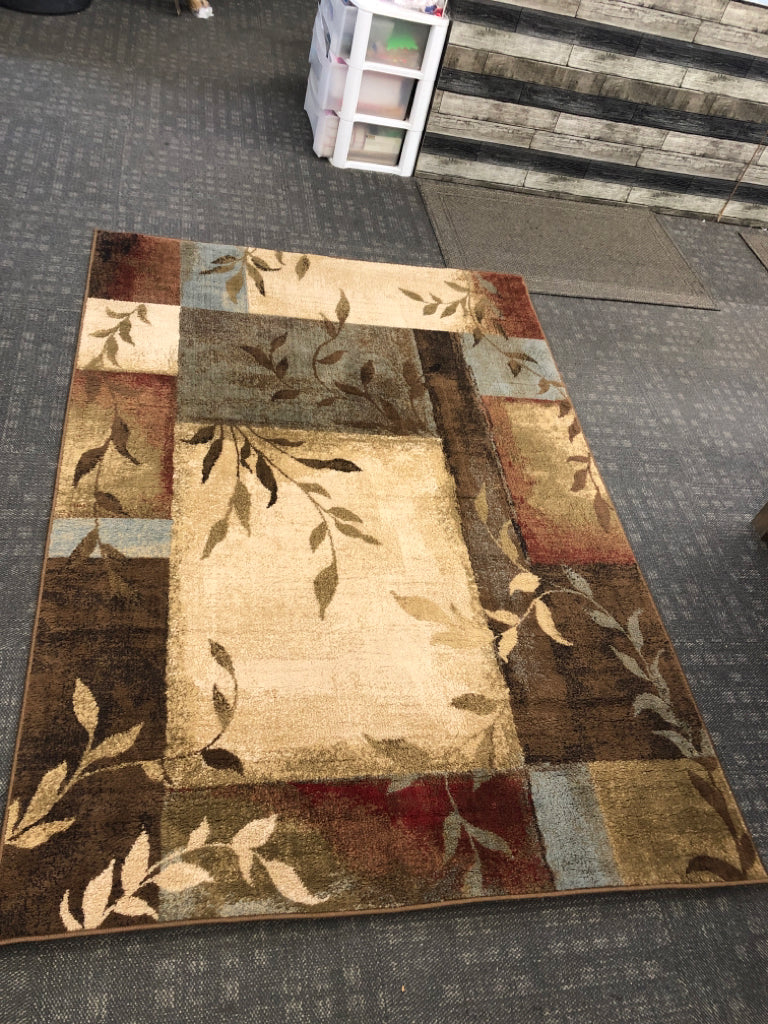 MULTICOLORED RUG W/LEAVES BROWN, RED & BLUE ORIENTAL WEAVERS.