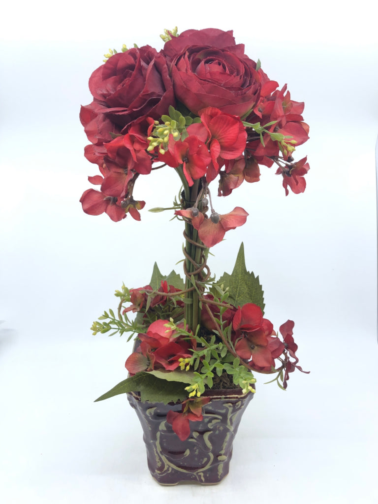 DISTRESSED RED PLANTER W/ FAUX RED FLOWERS.