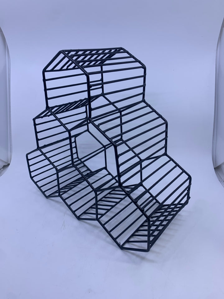 BLACK METAL OCTAGON SHAPED WINE RACK.