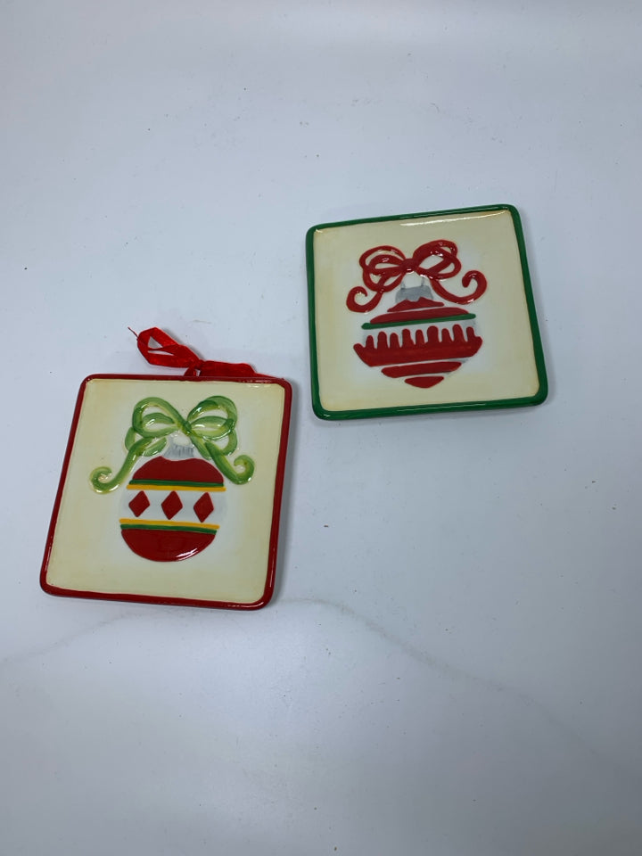 2 SMALL CERAMIC SQUARE EMBOSSED ORNAMENT WALL HANGING.