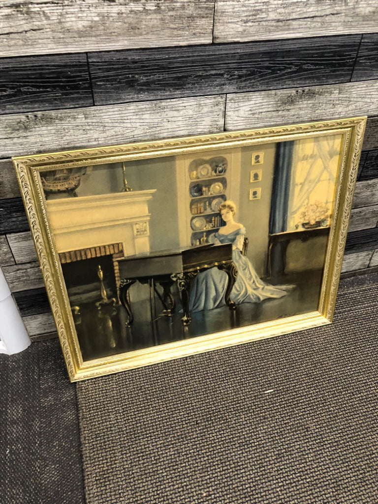 LADY AT PIANO PRINT IN SILVER FRAME.