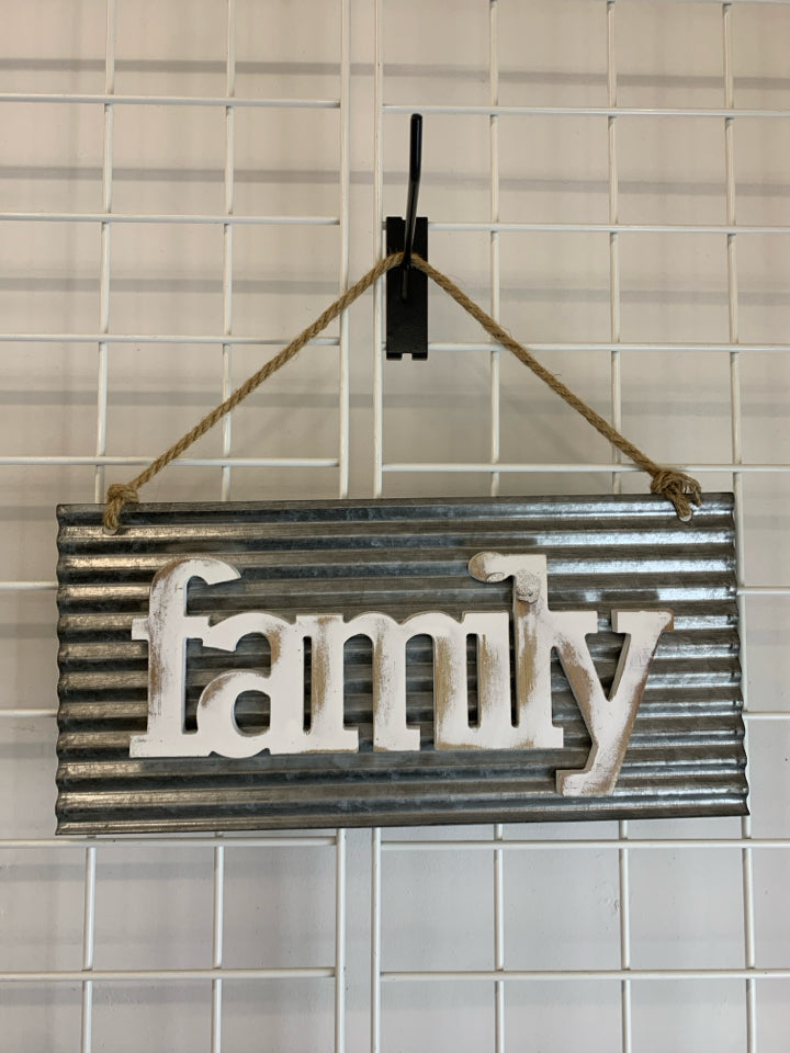 WOOD "FAMILY" SIGN ON METAL WALL HANGING.