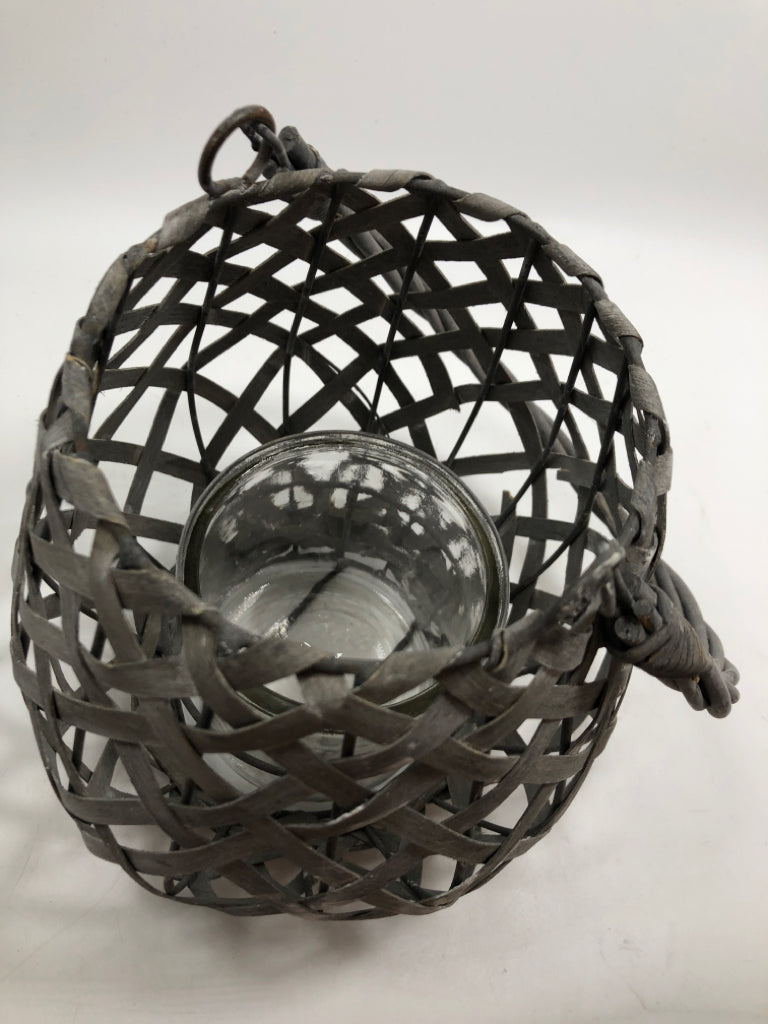 GRAY WOVEN CANDLE LANTERN.