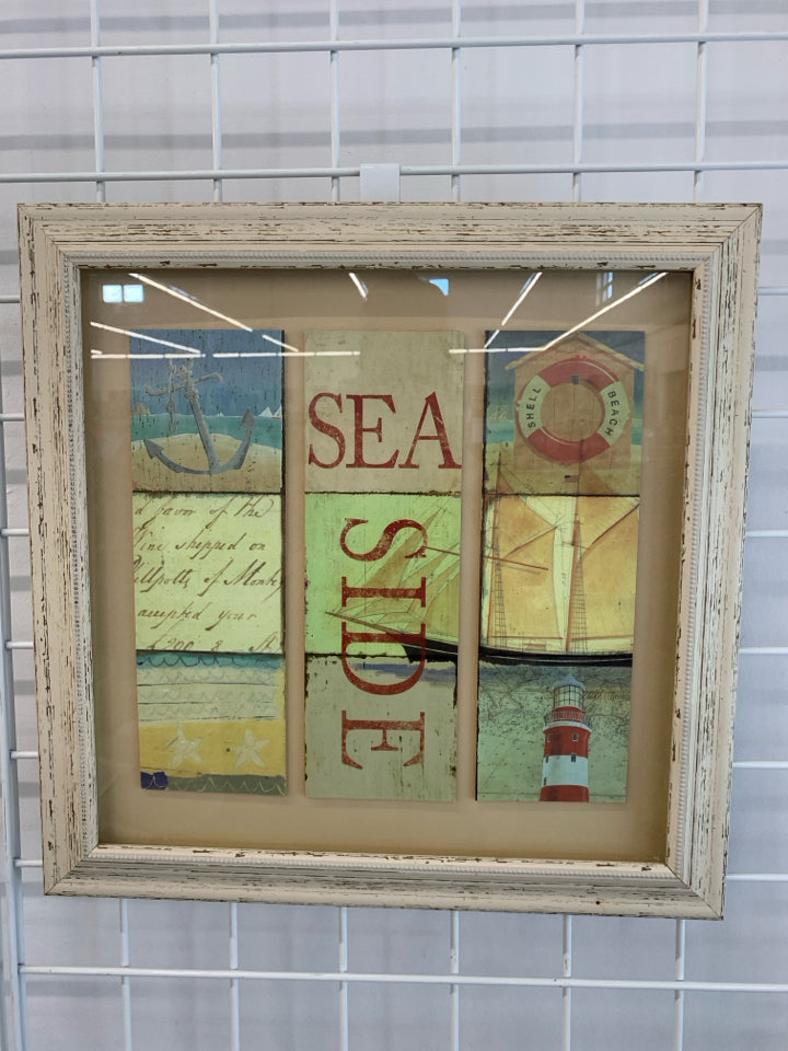 SEASIDE SHADOWBOX ART IN PINK WASHED FRAME.