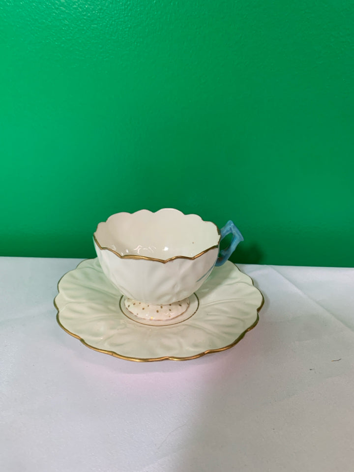 VTG CREAM AND GOLD ACCENT TEACUP AND SAUCER.