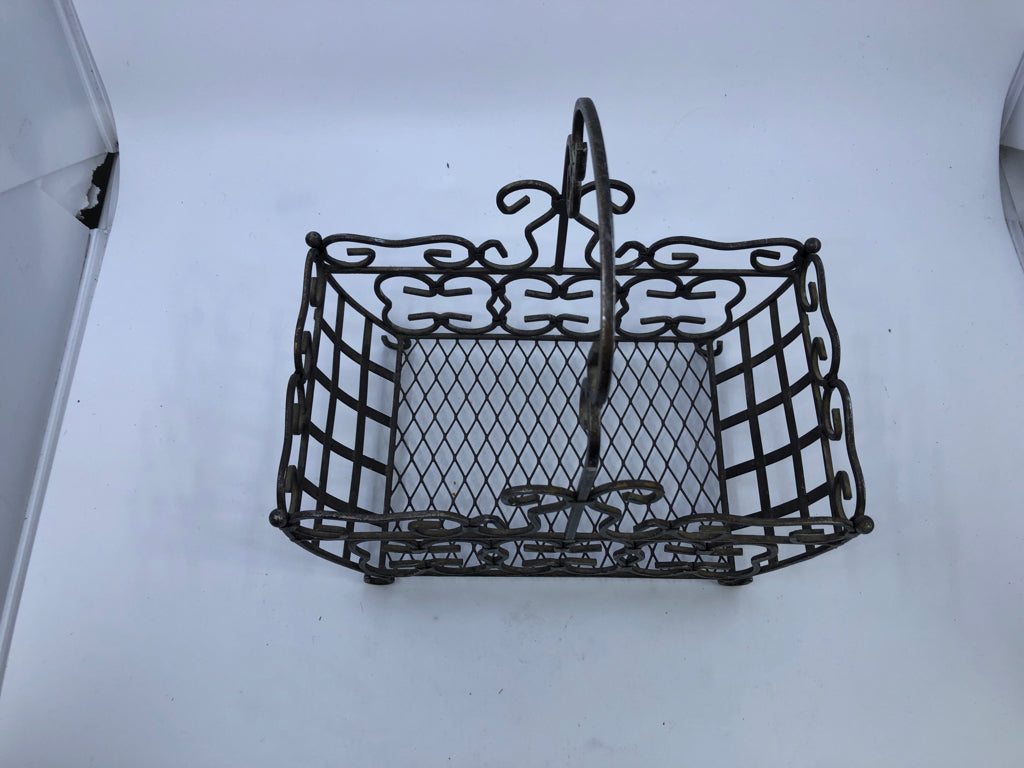 FOOTED METAL SCROLL BASKET W/ HANDLE.