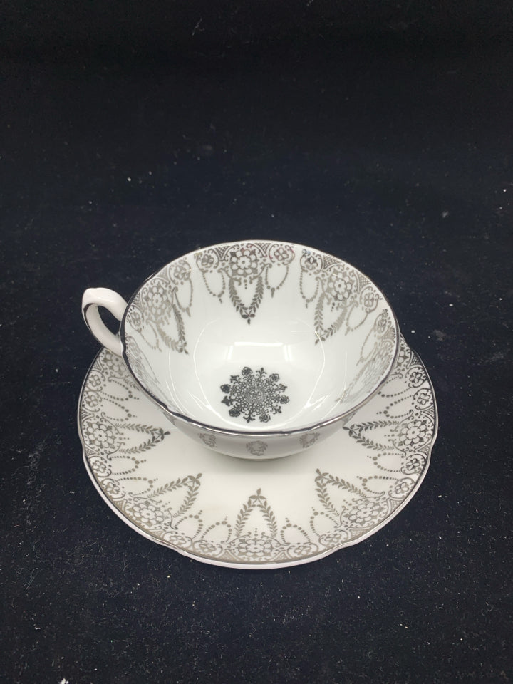 VTG WHITE SILVER TEACUP AND SAUCER.