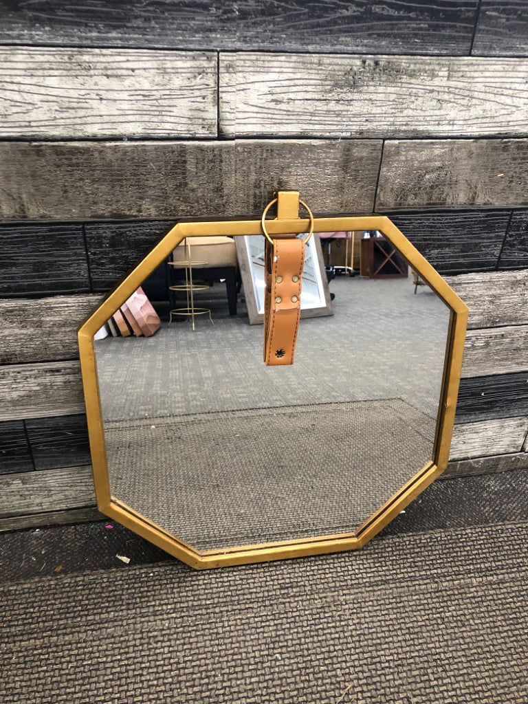 OCTAGONAL GOLD MIRROR W/LEATHER STRAP WALL HANGING.
