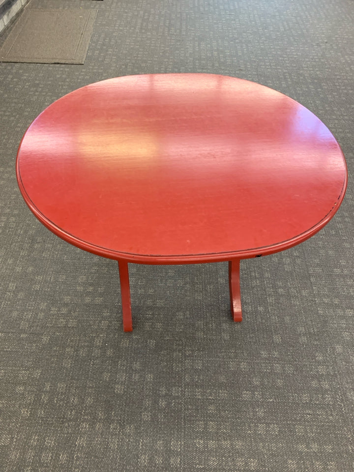 OVAL RED FLIP TOP TABLE.