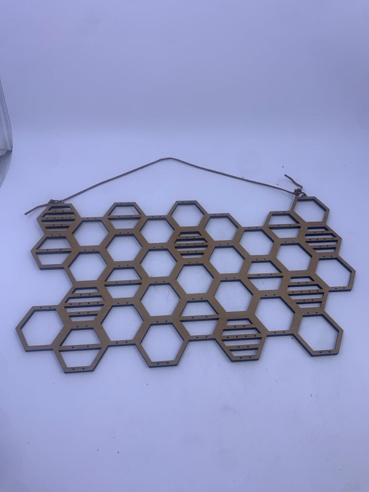 WOOD HONEY COMB JEWELRY HOLDER.