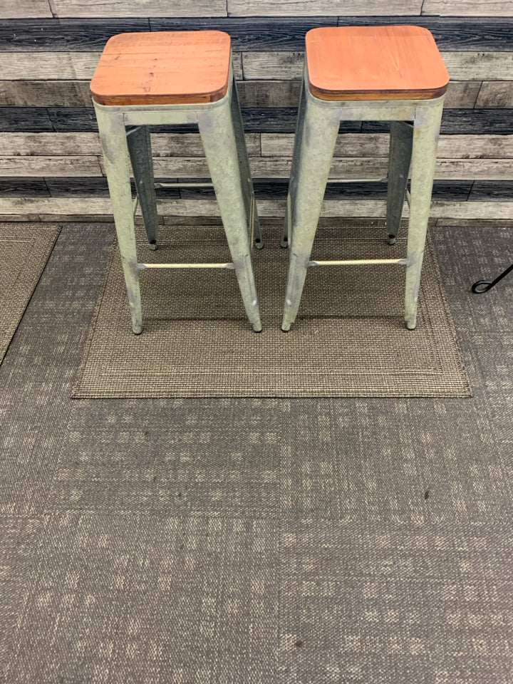 2 GALVANIZED WOOD TOP STOOLS.