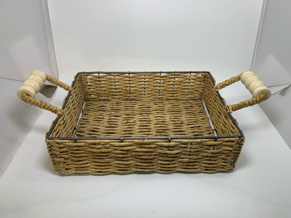 WOVEN BASKET TRAY W/ CREAM CERAMIC HANDLES.