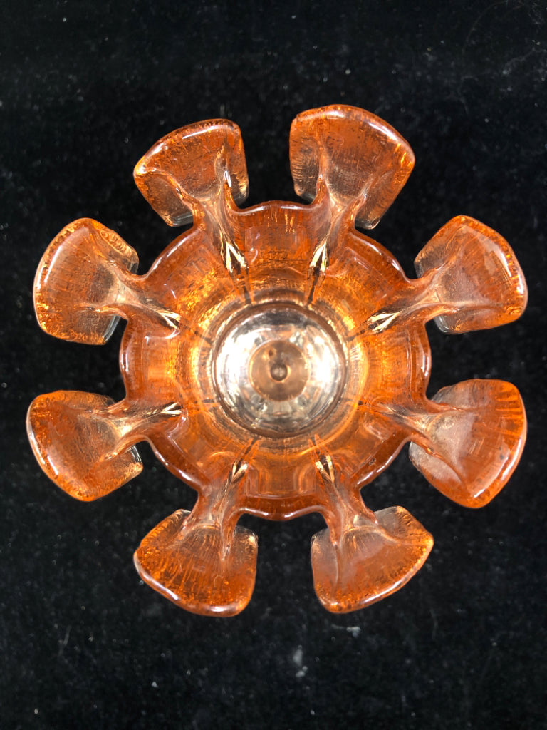 ORANGE PINCHED CANDLE HOLDER.