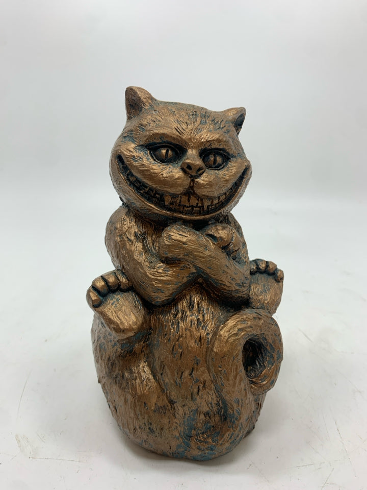 BRONZE PAINTED CHESHIRE CAT FIGURE.