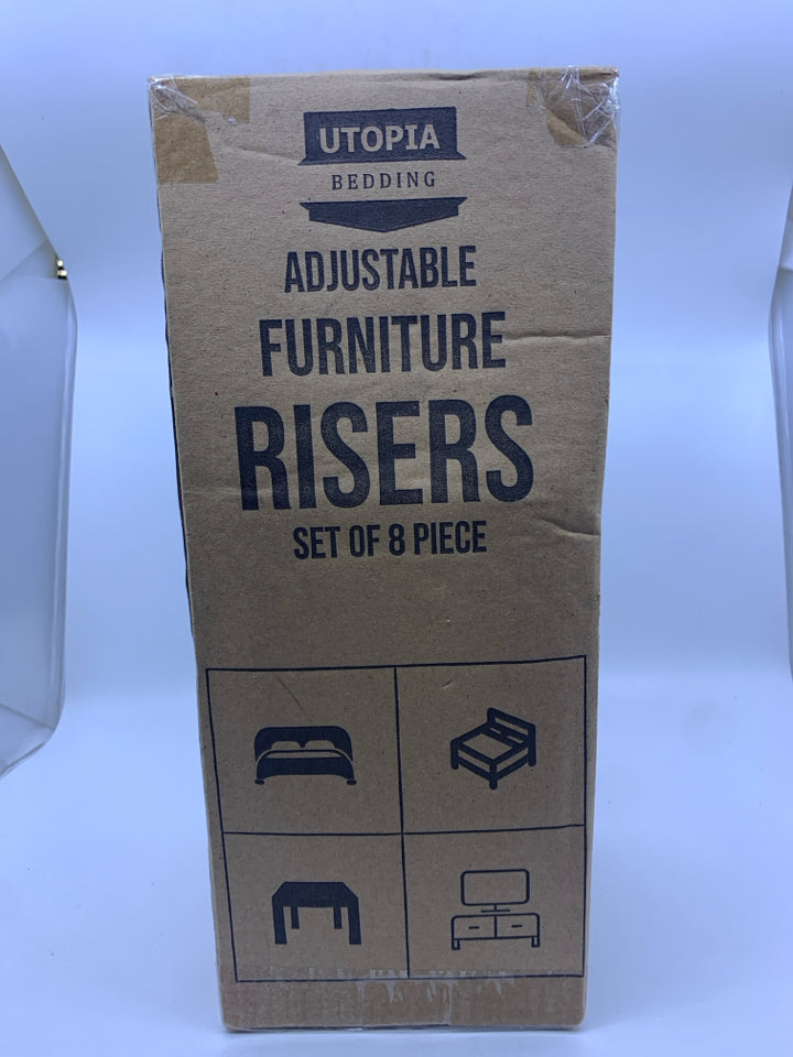 NIB FURNITURE RISERS.