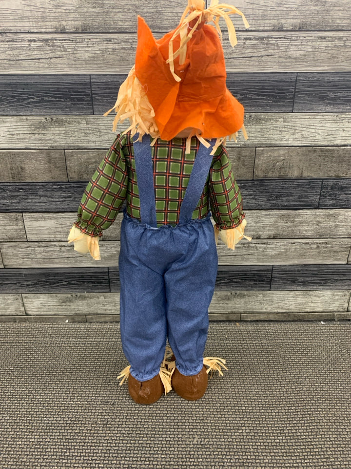 SCARECROW IN BLUE OVERALLS STANDING DECOR.