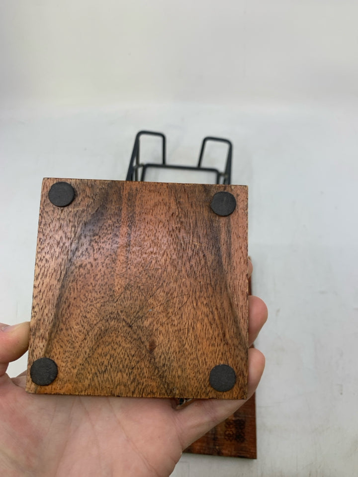 4 CARVED WOOD COASTERS IN STAND