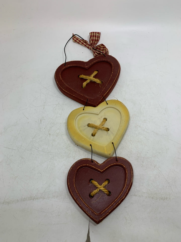 3 STACKED HEARTS WALL HANGING.