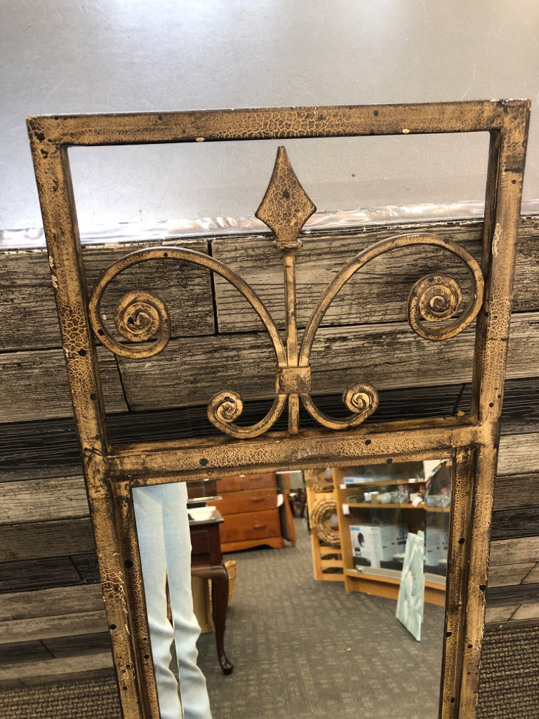 BRONZE MIRROR W/SCROLL DESIGN FRAME.