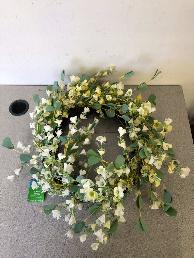 WHITE SMALL FLOWERS W/ GREEN LEAVES WREATH.