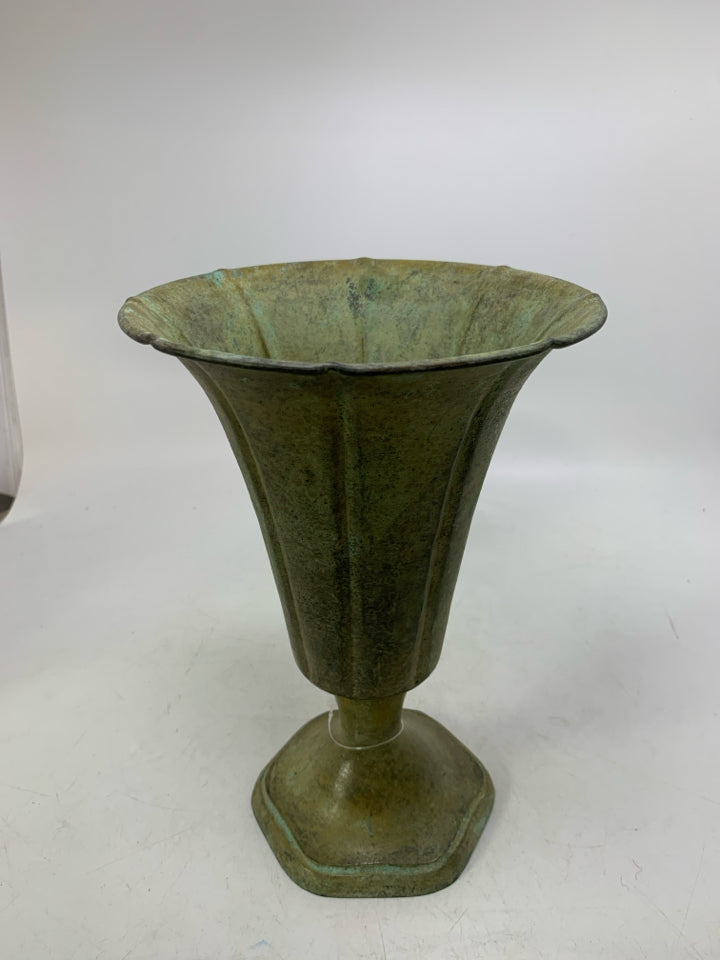 DISTRESSED FOOTED GREEN METAL VASE.