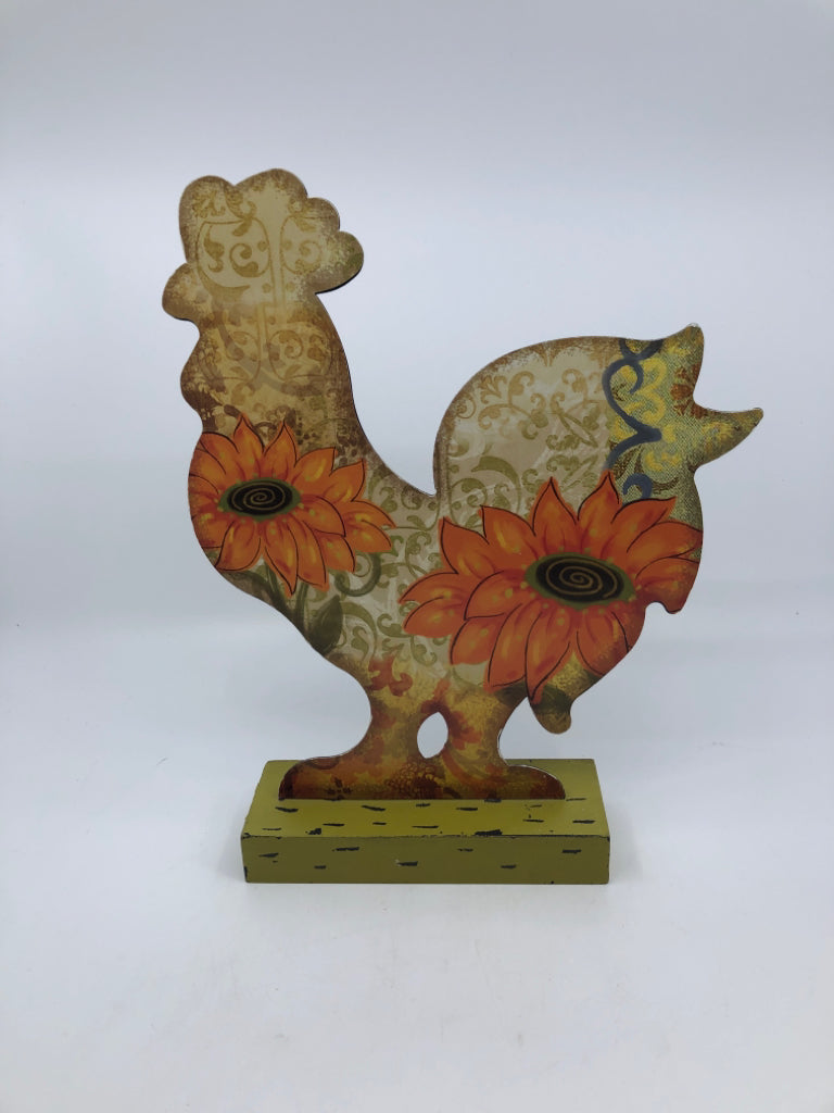 METAL ROSTER ON GREEN WOOD BASE W ORANGE SUNFLOWER PATTERN.