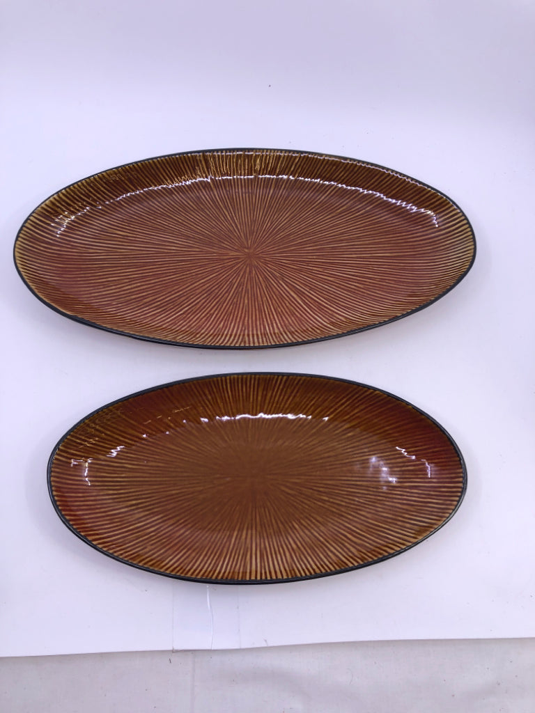 2 BROWN OVAL CERAMIC SERVING PLATES.