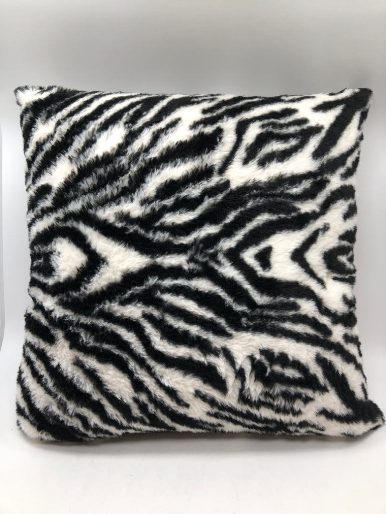 FUZZY ZEBRA ACCENT PILLOW.