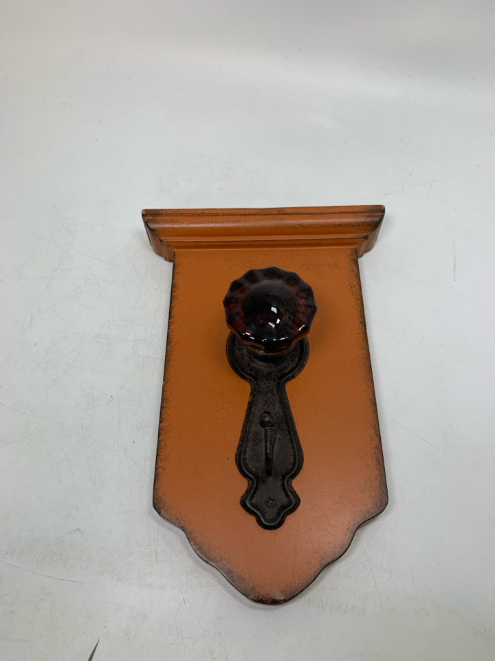 RUSTING DOOR KNOB HOOK WALL HANGING.
