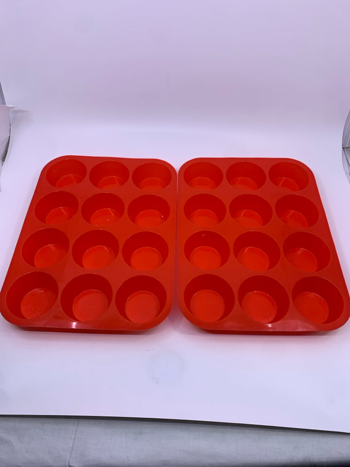 2 RED SILICONE MUFFIN PANS.