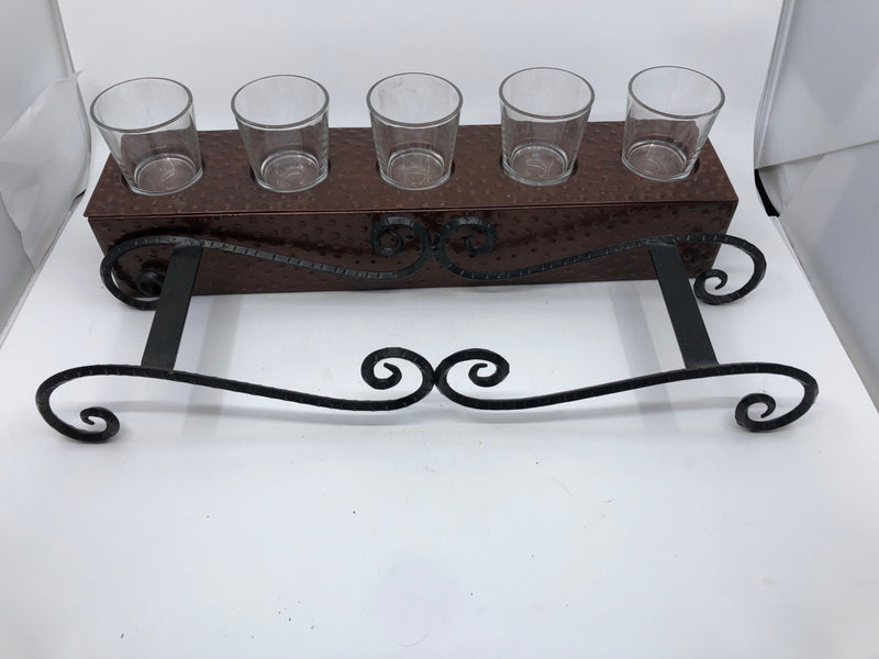 METAL FOOTED VOTIVE CANDLE HOLDER.