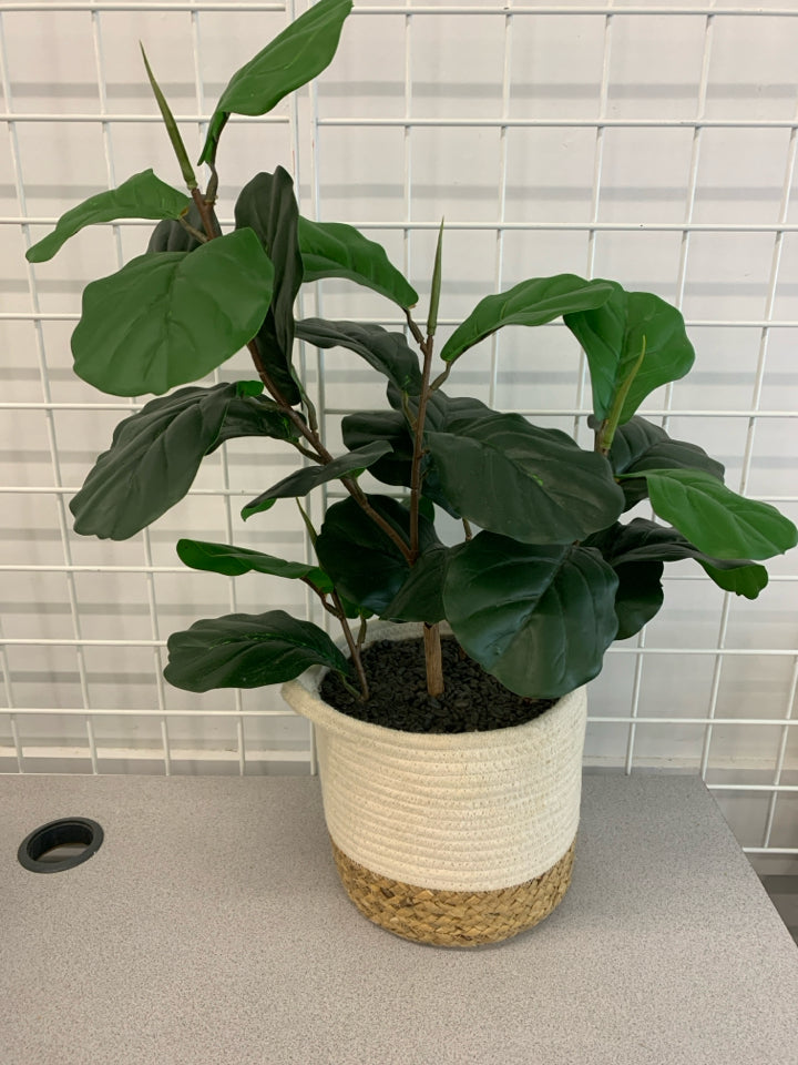 FAUX PLANT IN WOVEN POT.