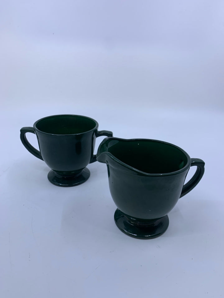 FOOTED DARK GREEN PAINTED GLASS CREAM/SUGAR SET.