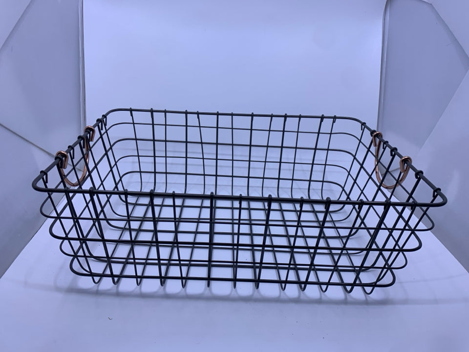 METAL WIRE BASKET W/ ROSE GOLD HANDLES.