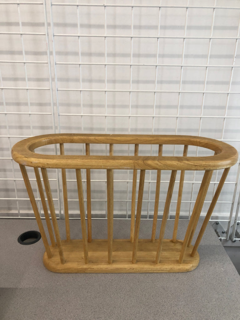 OVAL WOODEN MAGAZINE HOLDER.