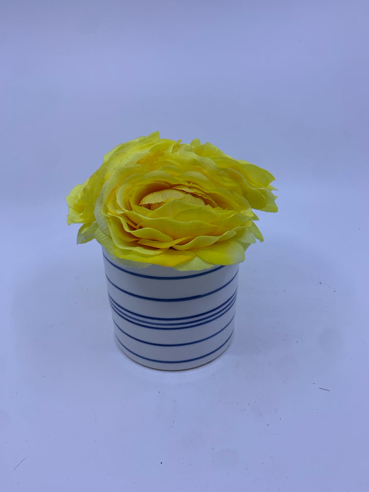 YELLOW FLORAL IN BLUE AND WHITE VASE.