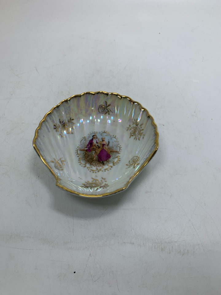 FOOTED IRIDESCENT SHELL SHAPED BOWL W/ VICTORIAN PEOPLE IN CENTER.