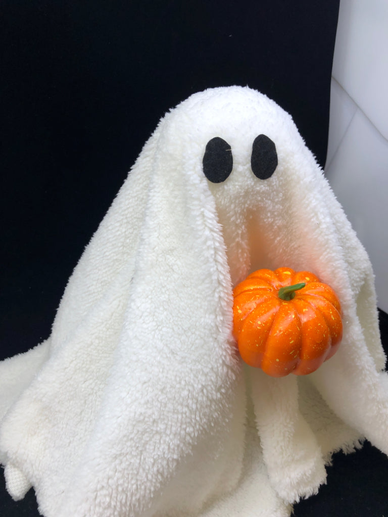 PLUSH GHOST HOLDING ORANGE PUMPKIN.