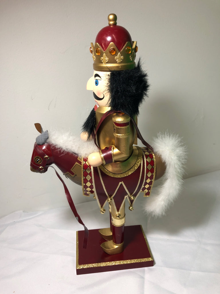 RED AND GOLD NUT CRACKER .