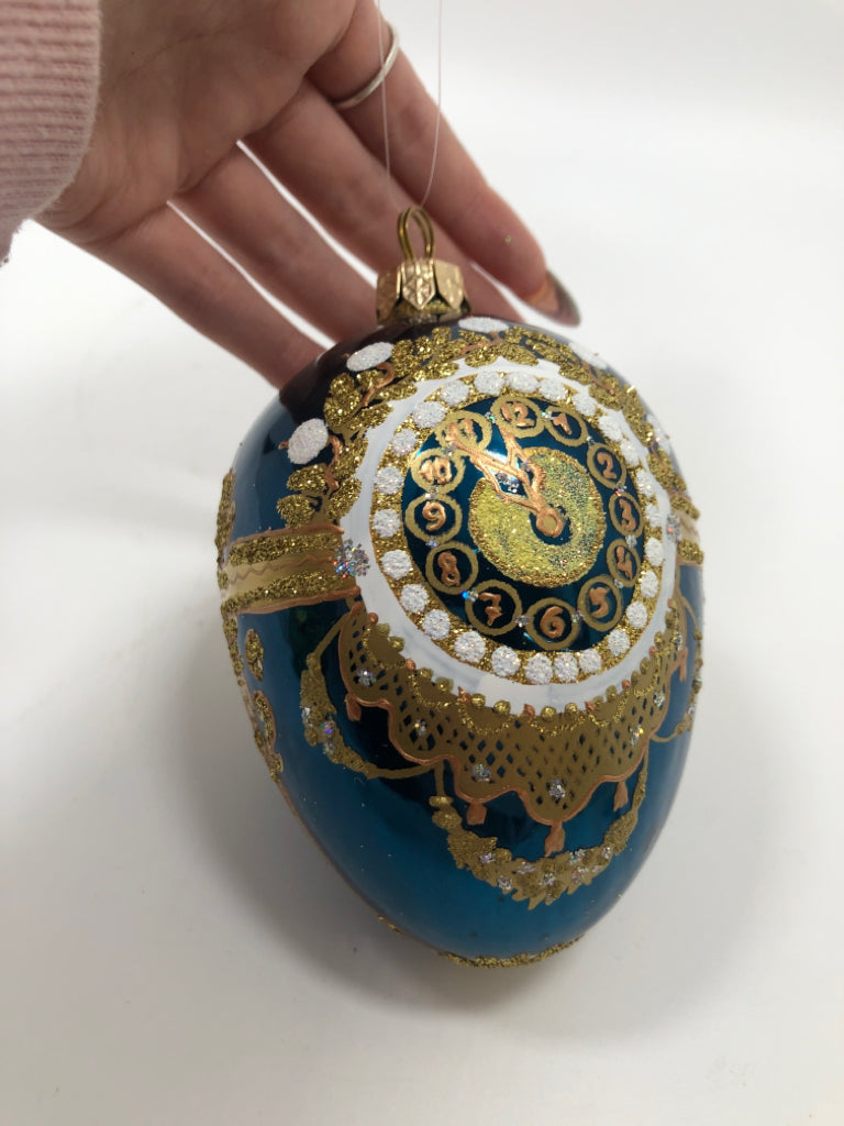 BLUE & GOLD EGG SHAPED ORNAMENT.